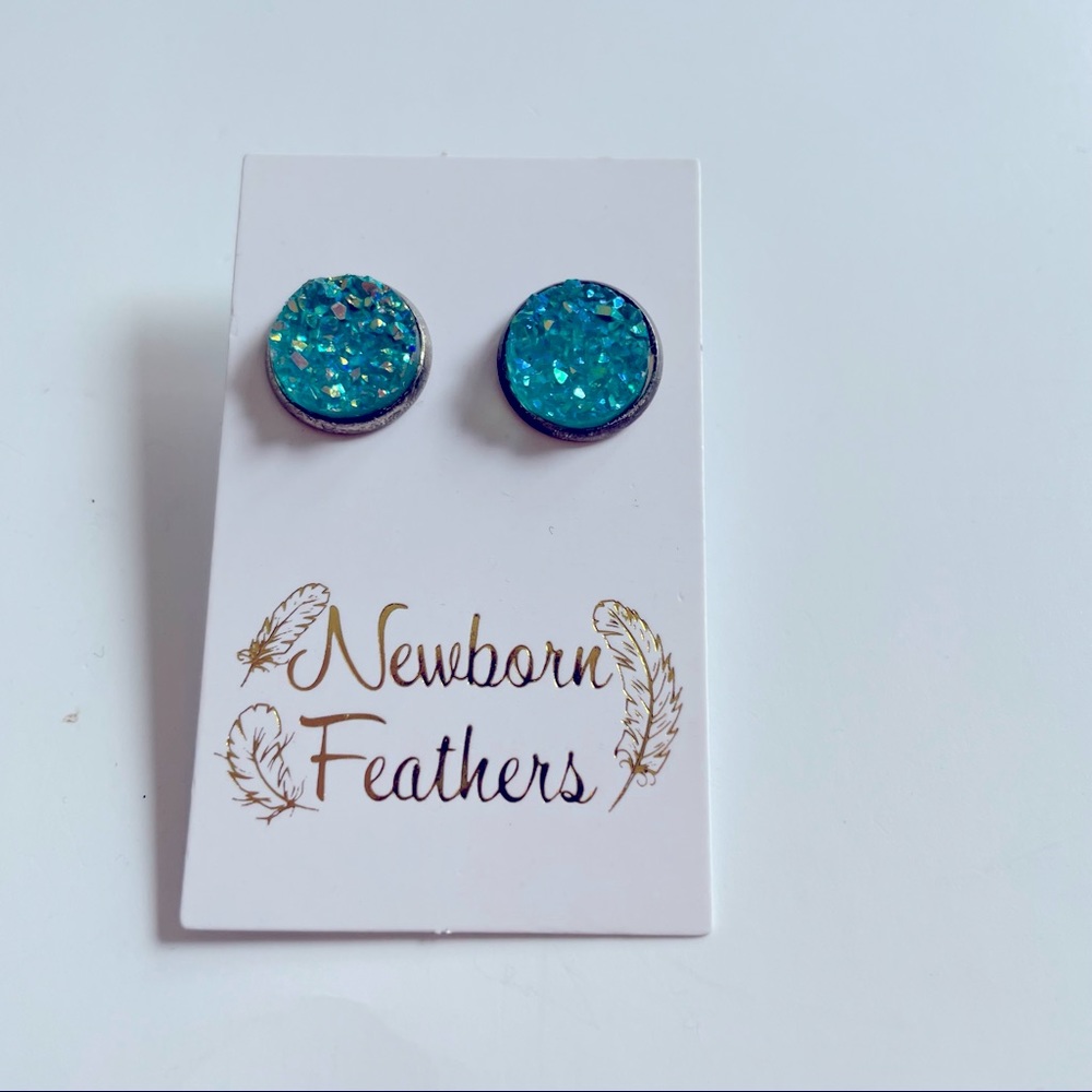 Newborn feathers earrings teal with a pewter colour setting